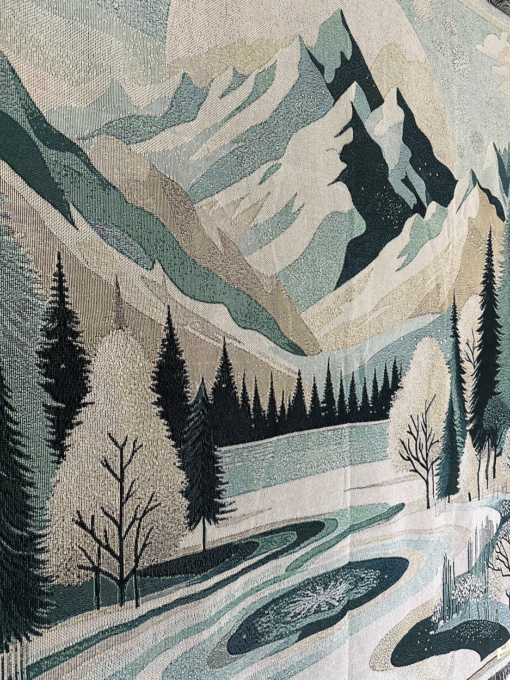 Een wandkleed met een winterlandschap
