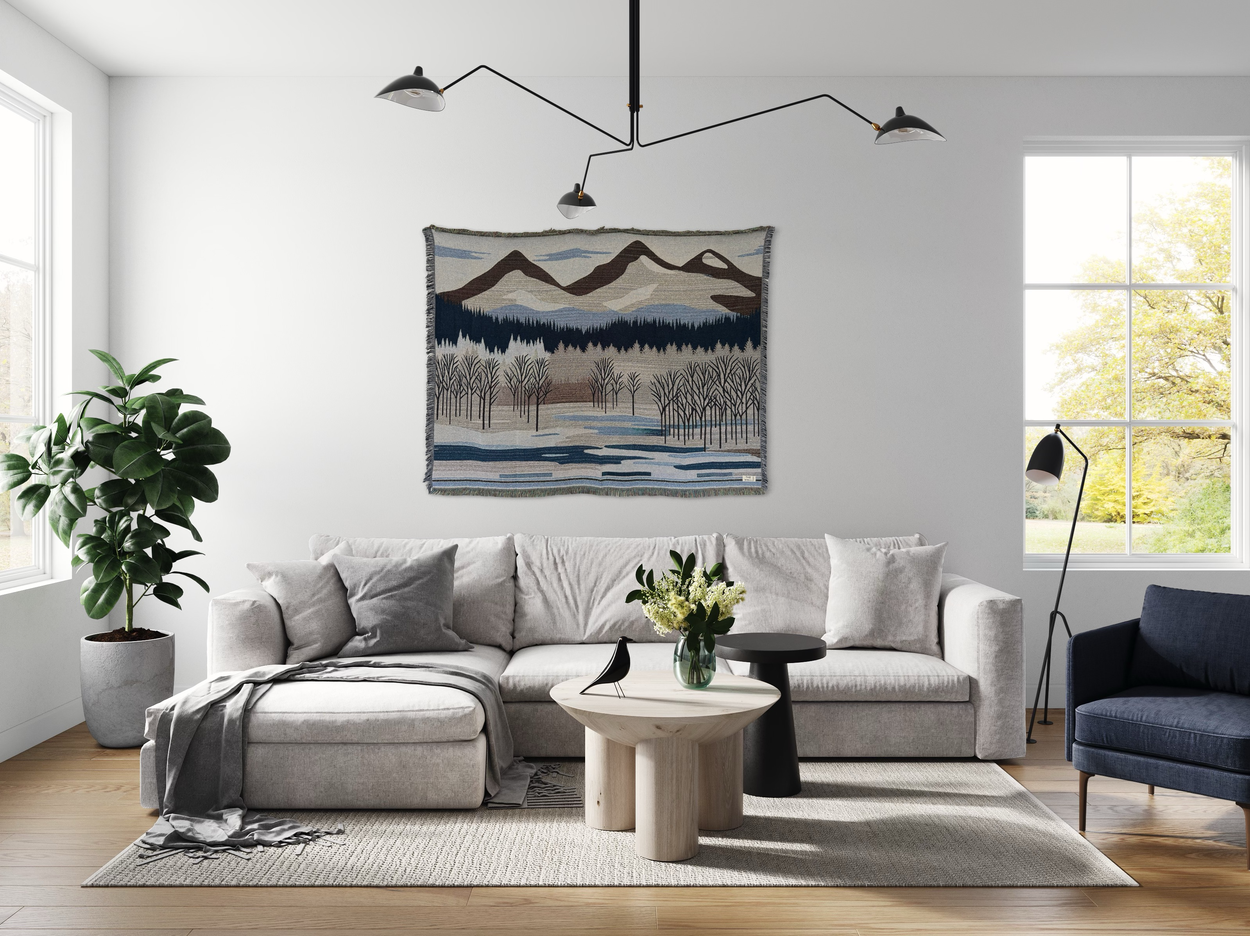 Een wandkleed met een berglandschap